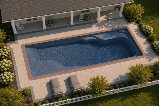 Daytime render of the Ariel 16 fiberglass pool with brick coping and a Ocean Blue interior, seen from above at an angle.