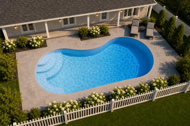 Daytime render of the Jamaica 10 fiberglass pool with cantilever coping and a Sapphire Blue interior, seen from above at an angle.