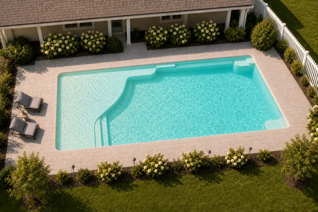 Daytime render of the Grace Beach Entry 1640 fiberglass pool with cantilever coping and a Arctic Shimmer interior, seen from above at an angle.