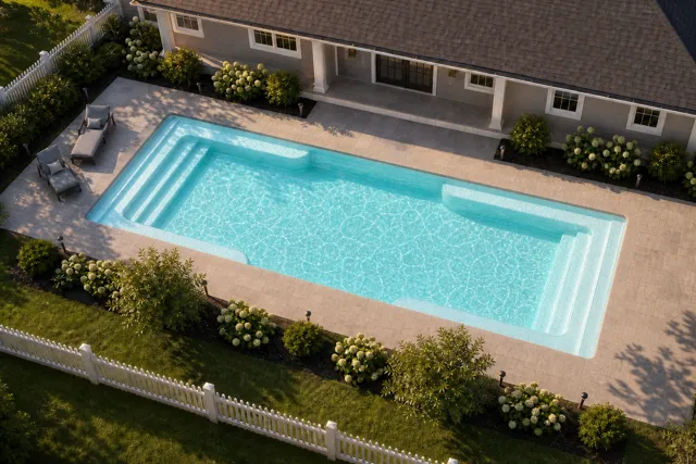 Daytime render of the Spirit fiberglass pool with cantilever coping and a Arctic Shimmer interior, seen from above at an angle.