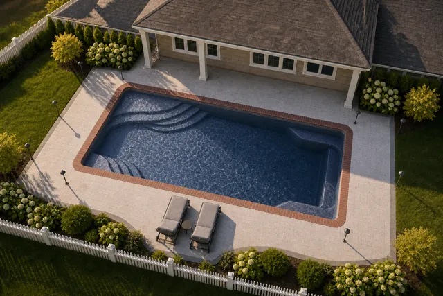 Daytime render of the Olympia 12 fiberglass pool with brick coping and a Ocean Blue interior, seen from above at an angle.