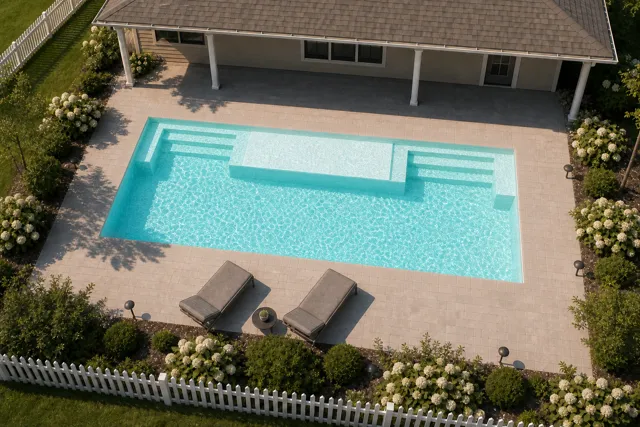Daytime render of the Magnate fiberglass pool with cantilever coping and a Arctic Shimmer interior, seen from above at an angle.