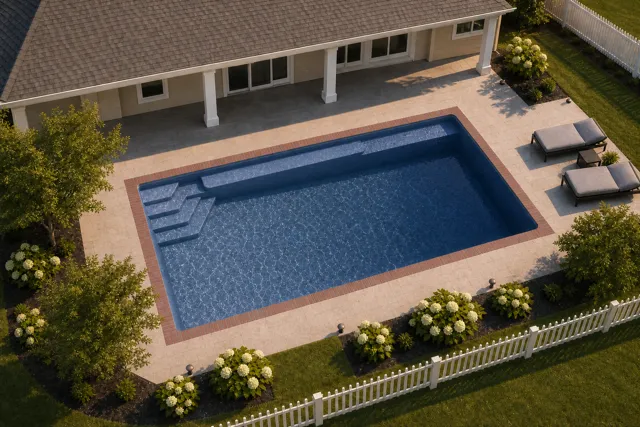 Daytime render of the Sirius fiberglass pool with brick coping and a Ocean Blue interior, seen from above at an angle.