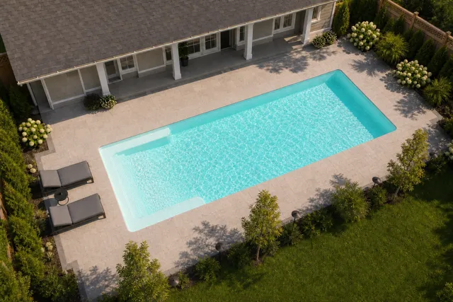Daytime render of the Big Bob fiberglass pool with cantilever coping and a Arctic Shimmer interior, seen from above at an angle.