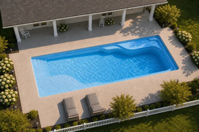 Daytime render of the Ariel 16 fiberglass pool with cantilever coping and a Sapphire Blue interior, seen from above at an angle.