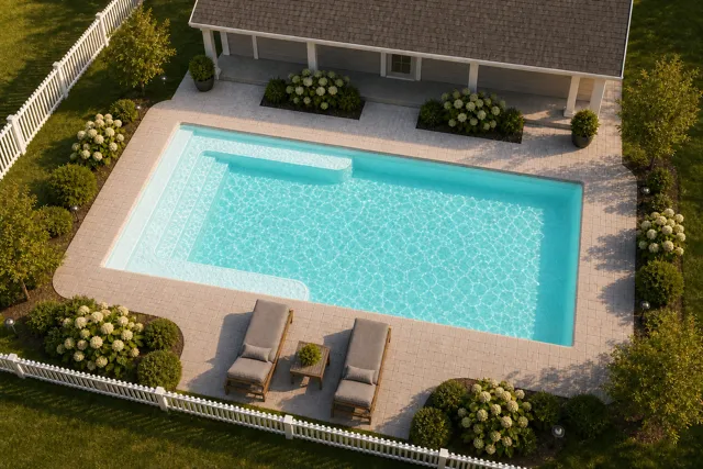 Daytime render of the Lil Bob fiberglass pool with cantilever coping and a Arctic Shimmer interior, seen from above at an angle.