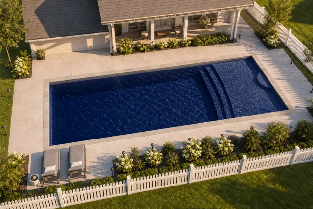 Daytime render of the Cayman 16 fiberglass pool with stone coping and a Night Sky interior, seen from above at an angle.