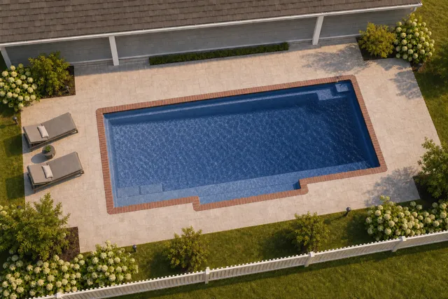 Daytime render of the Tuscan 14.30 fiberglass pool with brick coping and a Ocean Blue interior, seen from above at an angle.