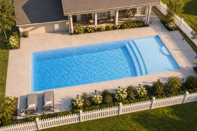 Daytime render of the Cayman 16 fiberglass pool with cantilever coping and a Sapphire Blue interior, seen from above at an angle.