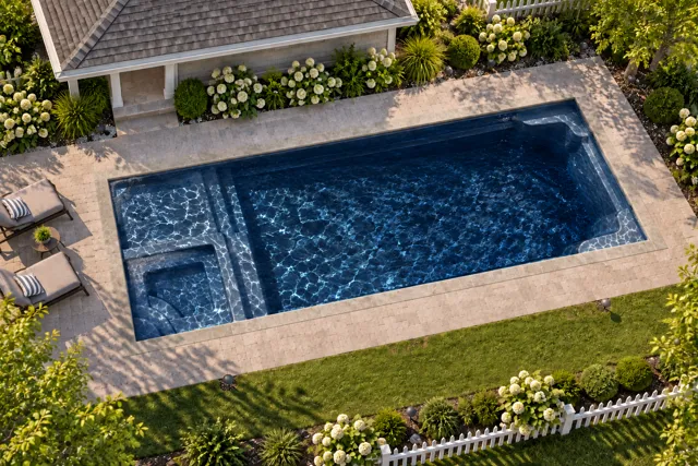 Daytime render of the Astoria 16 fiberglass pool with stone coping and a Night Sky interior, seen from above at an angle.