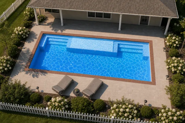 Daytime render of the Magnate fiberglass pool with brick coping and a California interior, seen from above at an angle.