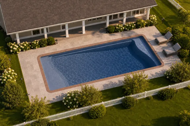 Daytime render of the Barcelona fiberglass pool with brick coping and a Ocean Blue interior, seen from above at an angle.