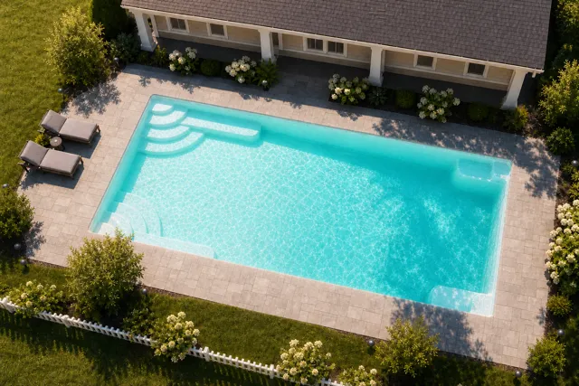 Daytime render of the Goliath 1429 fiberglass pool with cantilever coping and a Arctic Shimmer interior, seen from above at an angle.